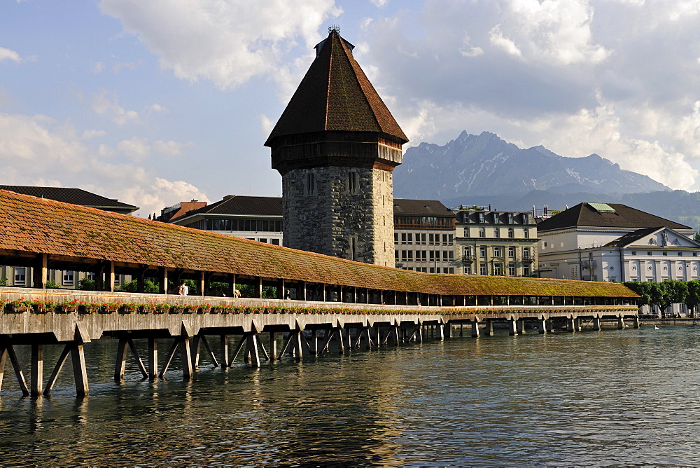 Chapel Bridge over Reuss River in Lucerne, Pilatus Mountain looming above the city at back, Canton of Lucerne, Switzerland, Europe