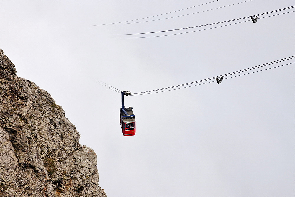 Gondola cableway to Mount Pilatus emerging from a sea of fog, Mount Pilatus, a recreational mountain at Vierwaldstaettersee, Lake Lucerne, near Lucerne, Switzerland, Europe