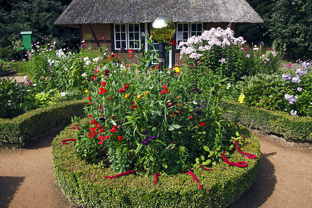 Low German cottage garden with a rondel, box hedge, Garden phlox (Phlox paniculata) and other summer flowers, Botanical Garden Hamburg, Germany, Europe