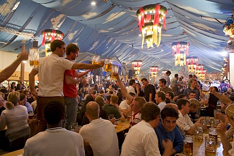 People drinking beer in a beer tent, Cannstatter Festival, Bad Cannstatt, Stuttgart, Baden-Wuerttemberg, Germany