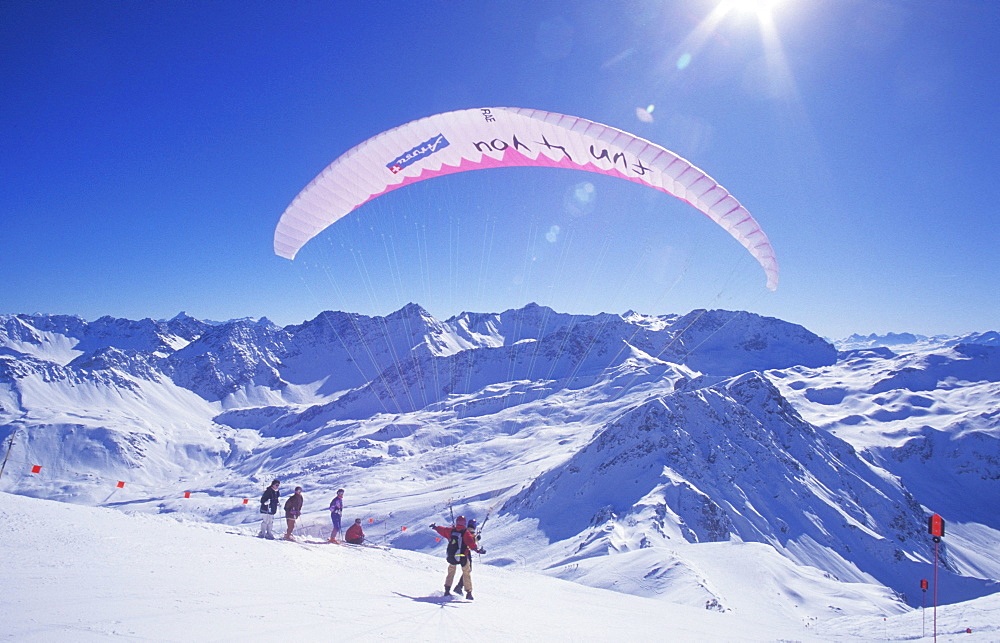 Paraglider on Mt. Weisshorn in winter, paragliding, tandem flight, mountain panorama, Arosa, Grisons, Switzerland, Europe