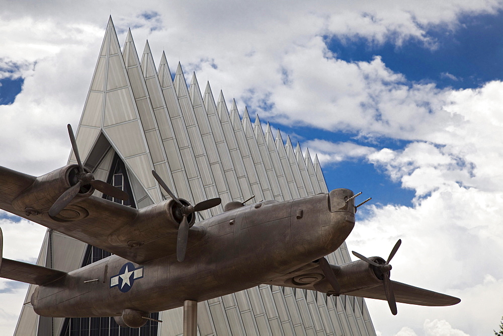 A model of a B-24 Liberator, a bomber used in World War II, in front of the Cadet Chapel at the United States Air Force Academy, Colorado Springs, Colorado, USA