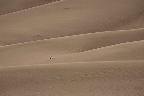 Sand dunes with people, Southern Colorado, USA