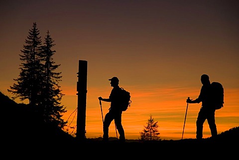 Silhouettes of two hikers, hiking tour in the evening, Styria, Austria, Europe