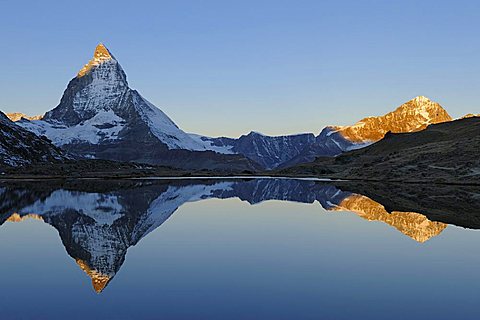 Matterhorn reflection in Riffelsee, morning light, Zermatt, Wallis, Switzerland, Europe