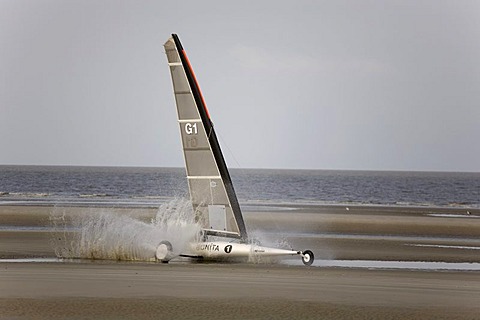 Beach sailer spraying water in St Peter Ording, North Sea, North Frisia, Schleswig-Holstein, Germany, Europe