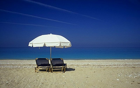 Sunshade, sun loungers, beach in the West of the Island of Kefalonia, Greece, Europe