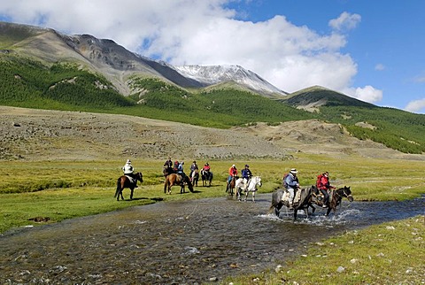 Group of tourists with horses riding through a river, Saljugem, Sailughem, Saylyugem Mountains, Tschuja Steppe, Altai Republic, Siberia, Russia, Asia