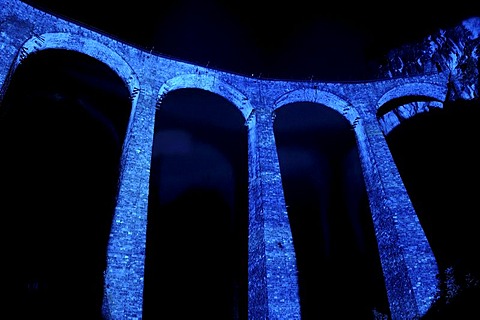 Irrigation water viaduct lit up to celebrate the acceptance of the "Rhaetische Bahn Railway in Albula/Bernina" as a UNESCO World Heritage Site, Filisur, Graubuenden, Switzerland, Europe