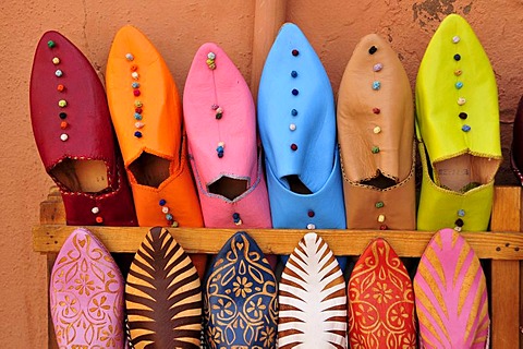 Typical Moroccan leather slippers in a shoe shop at the souk, market, in the medina quarter of Marrakesh, Morocco, Africa