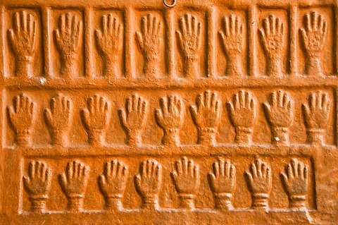 Sati stones, hand imprints of the 15 royal widows of Maharaja Man Singh who committed self-immolation, Mehrangarh Fort, Jodhpur, Rajasthan, India, South Asia