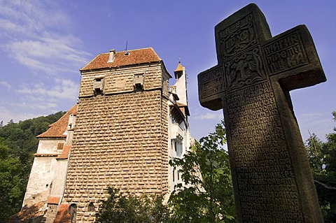 Bran Castle or DraculaÃ­s Castle, stone cross at front, Wallachia, Carpathian Mountains, Romania