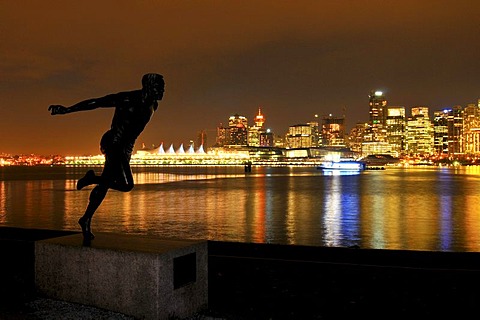 Skyline in front of Coral Harbour, at dusk, and the statue 'the runner', Vancouver, British Columbia, Canada, North America