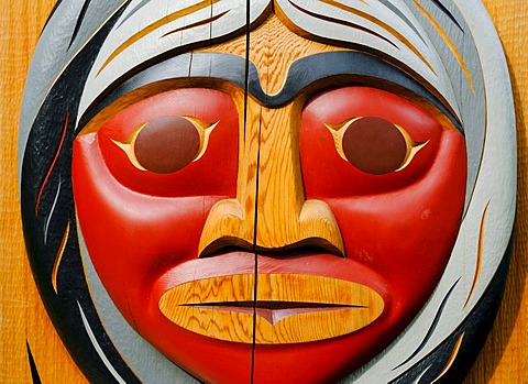 Face carved into a totem pole in Stanley Park, Vancouver, British Columbia, Canada, North America