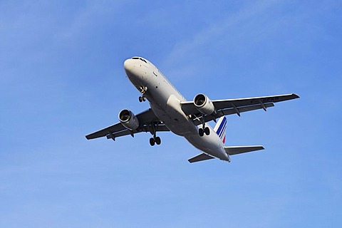 Commercial aircraft, Air France KLM, climbing against a light-blue sky, perspective from diagonally below