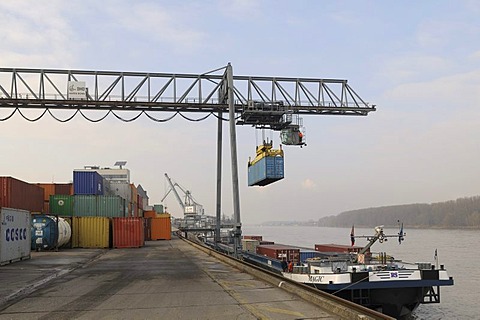 Port of Bonn, bimodal handling, gantry crane loading a container onto an inland navigation container ship, Magic, while docked on the quay, North Rhine-Westphalia, Germany, Europe