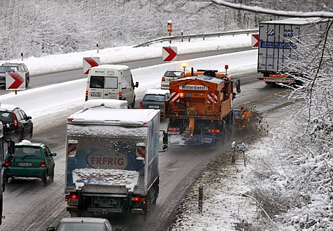 Snow plough in operation, traffic jam after heavy snow fall, motorway Autobahn A40, Ruhr expressway between Duisburg and Essen, near Muelheim, North Rhine-Westphalia, Germany, Europe