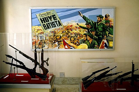 Picture of the revolution with Fidel Castro, guns in show cases, Museo de la Revolucion, Centro Habana, Havana, Cuba, Caribbean