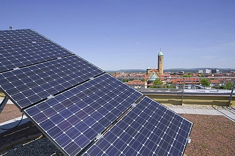 Solar installation on the roof of the Bamberg public utility company, behind it the Otto church, Bamberg, Bavaria, Germany, Europe