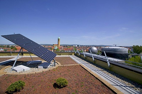 Solar installation on the roof of the Bamberg public utility company, behind it the Otto church, Bamberg, Bavaria, Germany, Europe