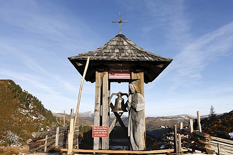 Wishing bell near Glockenhuette mountain on Nockalm Road, Nockberge National Park, Carinthia, Austria, Europe