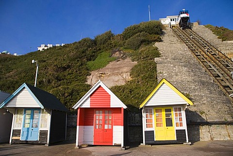 Beach huts and the car of the West Cliff Lift, funicular railway, Bournemouth, Dorset, England, United Kingdom