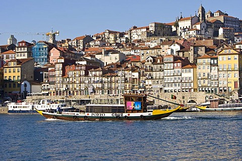 Typical tourist boat on the Duoro River, at back the Ribeira Quay, Porto, UNESCO World Cultural Heritage Site, Portugal, Europe