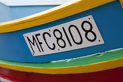 Registration number, traditional fishing boat, called Luzzu, port of Marsaxlokk, Malta, Europe