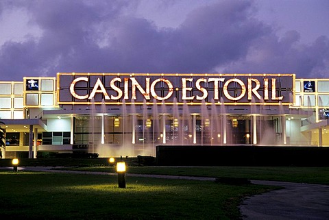 Estoril Casino in the evening, modern architecture, illuminated facade, spa gardens of Estoril, sophisticated sea resort, Lisbon, Lisboa, Portugal, Europe