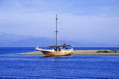 Yacht on the beach of Yassica Adalari Island, Bay of Fethiye, Mugla Province, Mediterranean, Turkey