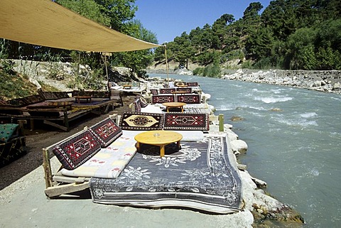 Cafe terrace at the river bed of the Esen Cay River in a nature reserve, Saklikent, Akdagi Mountains, Fethiye, Mugla Province, Turkey