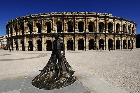 Bronze statue of the bull fighter Christian Montcouquiol, El Nimeno II, in front of the Arena, the Nimes Antique Theater, Provence, France, Europe