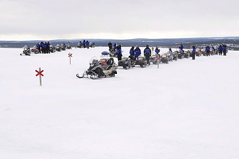 Snowmobile on a tour in the Saariselkae skiing area, Ivalo, Lapland, Finland, Europe