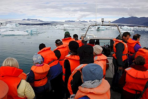 Passengers on a boat tour among icebergs, glacier, Joekulsarlon, Iceland, Europe