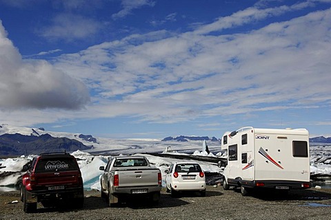 Parking area with campervan and cars at glacial lake, icebergs, glacier, Joekulsarlon, Iceland, Europe