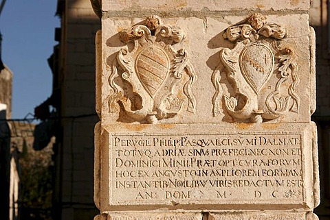 Insignia and Roman script in Trogir, Croatia, Europe