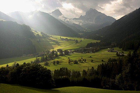 Atmospheric mood through clouds and sun rays in Pragser Valley, Alto Adige, Italy, Europe