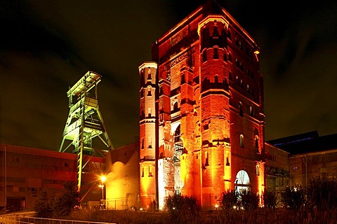 Illuminated Malakow Tower and shaft tower of the Ewald pit, Herten, Ruhr area, North Rhine-Westphalia, Germany, Europe