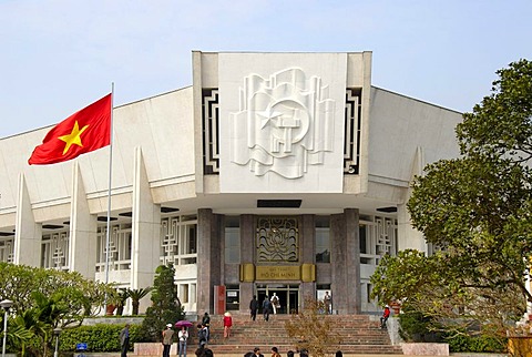 National Museum with the Vietnamese national flag and socialist symbols star, hammer and sickle, Hanoi, Vietnam, Asia