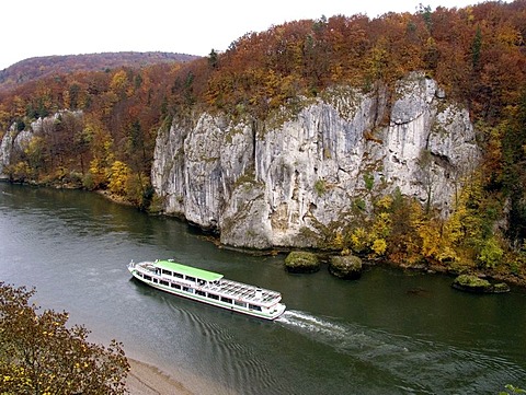 Excursion vessel on the Danube navigating through the Donaudurchbruch where the Danube breaks through the cliffs near Kelheim, Bavaria, Germany, Europe