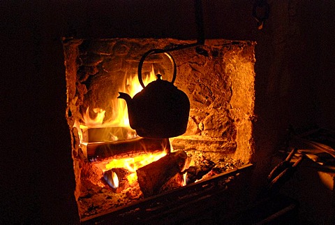 Kettle in an open fireplace in a historical cottage in the Grampians, Scotland, Great Britain, Europe