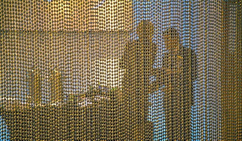 A man and a woman behind a screen in a VIP restaurant at the Motor City Casino, Detroit, Michigan, USA