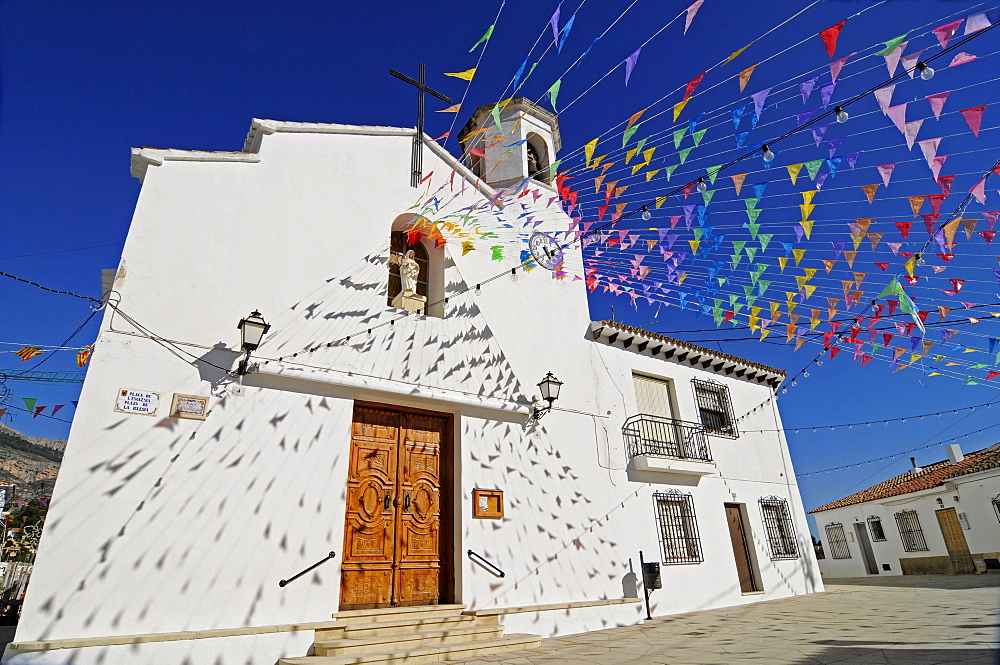 Small colourful flags outside Santa Ana Church during fiesta, Altea la Vella, Alicante, Costa Blanca, Spain