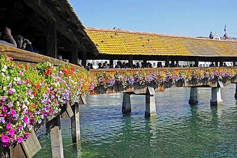 Kapellbruecke, Chapel Bridge, people, flowers, Reuss River, Lucerne, Switzerland, Europe