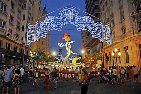 Hogueras de San Juan, Fogueres de Sant Joan, fiesta, country fair, papiermache figures, coloured lights, people, street, evening, night, Alicante, Costa Blanca, Spain, Europe