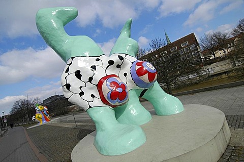 Hannover Niedersachsen Germany Nanas figurs of the artist Niki S. Phalle at the river Leine in front of the historic town