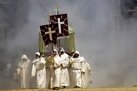 Monks in white cowls carries red flags with cross are befog, knight festival Kaltenberger Ritterspiele, Kaltenberg, Upper Bavaria, Germany