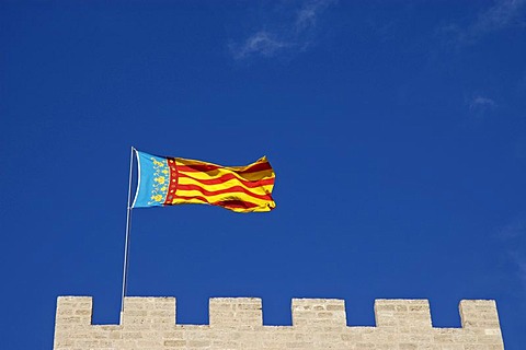 Valencian flag on the city gate, Torres de Serranos, Valencia, Spain