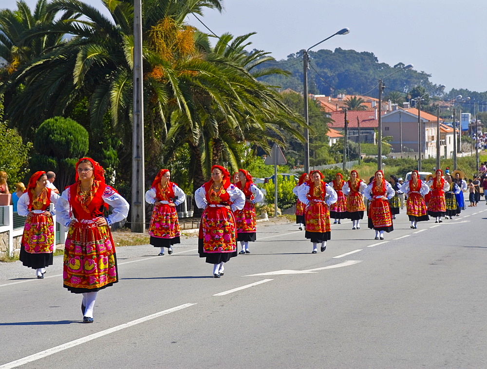 Traditionally dressed women, folk festival in honour of the three public saints Santos Populares, near by Porto, Portugal