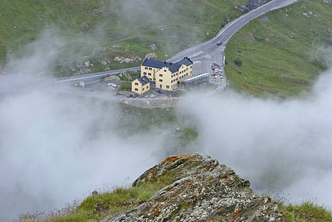 Alpine hotel Glocknerhaus between evening fog Carinthia Austria